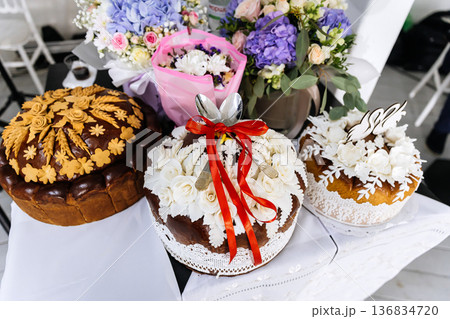Traditional wedding bread with swan decoration served at marriage celebration Traditional wedding bread with swan decoration served at marriage celebration 136834720