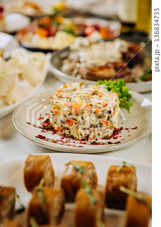 Olivier salad served as festive appetizer on restaurant table 136834735