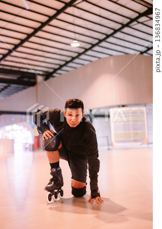 Focused Rollerblader Ready to Start an Intense Skating Session Focused Rollerblader Ready to Start an Intense Skating Session 136834967
