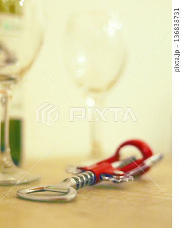 Corkscrew on Table with Glasses Corkscrew on Table with Glasses 136838731