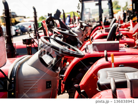 Rows of modern tractors. Industrial details. Agricultural  136838941