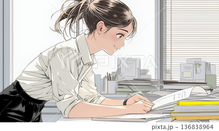 オフィスのデスクで、入念に書類をチェックする女性