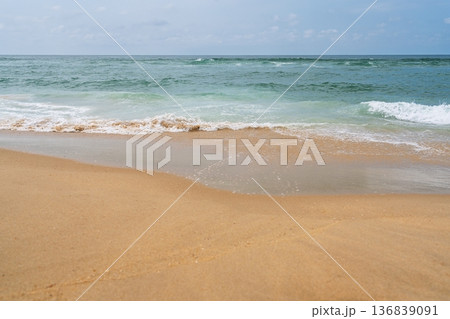 Golden Beach Meets Turquoise Sea A Tranquil Coastal Landscape for Relaxation and Escape 136839091