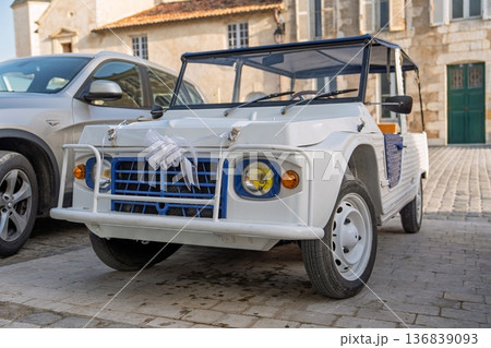 Charming White Vintage Car in Picturesque French Setting, france. A Classic Auto for Special Events Charming White Vintage Car in Picturesque French Setting, france. A Classic Auto for Special Events 136839093