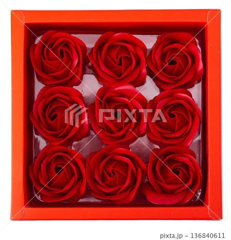 Red rose blossom in red box isolated on white background. 136840611