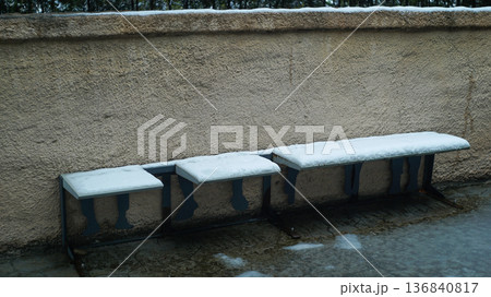 Bench covered in snow in the park Bench covered in snow in the park 136840817