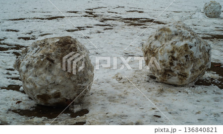 Dirt snowballs in winter park 136840821