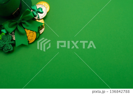 Beautiful table setting for St. Patricks Day celebration on green background Beautiful table setting for St. Patricks Day celebration on green background 136842788