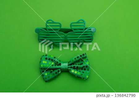 Beautiful table setting for St. Patricks Day celebration on green background Beautiful table setting for St. Patricks Day celebration on green background 136842790