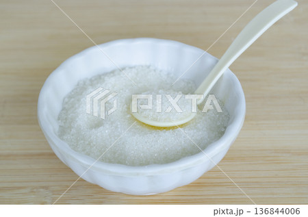 White small spoon stirring salt in ceramic bowl emphasizing mindful cooking practices and heart friendly diet choices.White small spoon stirring salt in ceramic bowl emphasizing mindful cooking White small spoon stirring salt in ceramic bowl emphasizing mindful cooking practices and heart friendly diet choices.White small spoon stirring salt in ceramic bowl emphasizing mindful cooking 136844006