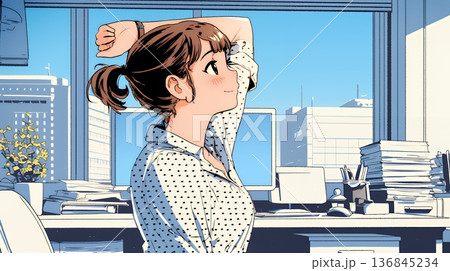 仕事の合間にストレッチ（伸び）をする女性