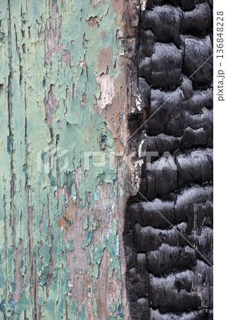 Peeling green paint and burnt black wooden post Peeling green paint and burnt black wooden post 136848228