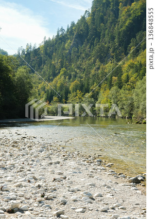 Wide Rocky Riverbed in the Alps on a Sunny Day 136848555