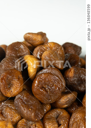 Heap of dried figs isolated on a white background. Heap of dried figs isolated on a white background. 136848599