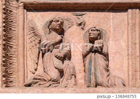 Annunciation to the Virgin Mary, relief on Facade of Sant`Anastasia Church in Verona, Italy Annunciation to the Virgin Mary, relief on Facade of Sant`Anastasia Church in Verona, Italy 136848755