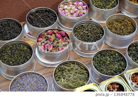 Various types of tea in metal pots exposed for sale in a Chinese tea shop in Shanghai Various types of tea in metal pots exposed for sale in a Chinese tea shop in Shanghai 136848778