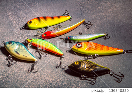 Colorful fishing lures and bobbers arranged on a table ready for successful fishing trip 136848820