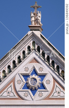 IHS sign, Basilica di Santa Croce (Basilica of the Holy Cross) - famous Franciscan church in Florence, Italy IHS sign, Basilica di Santa Croce (Basilica of the Holy Cross) - famous Franciscan church in Florence, Italy 136849392