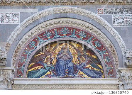 Virgin Mary, colourful mosaic by Giuseppe Modena da Lucca, above the middle door of Cathedral in Pisa, Italy. Unesco World Heritage Site. 136850749