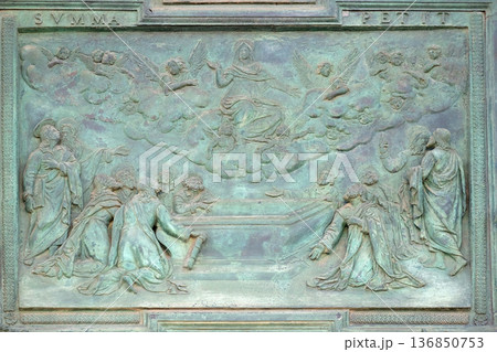 The Assumption of the Virgin Mary, panel from Giambologna's school, collocated in the central portal of the Cathedral St. Mary of the Assumption in Pisa, Italy The Assumption of the Virgin Mary, panel from Giambologna's school, collocated in the central portal of the Cathedral St. Mary of the Assumption in Pisa, Italy 136850753