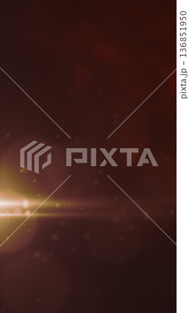 Atmospheric golden bokeh lights and warm cinematic flares in a soft abstract background 136851950