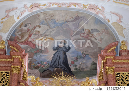 St. Francis kneeling on a cloud surrounded by music making angels, fresco on the ceiling of the Jesuit church of St. Francis Xavier in Lucerne, Switzerland 136852043