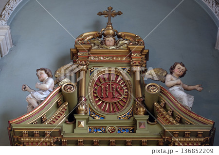 IHS sign on the altar in the Basilica of the Sacred Heart of Jesus in Zagreb, Croatia 136852209
