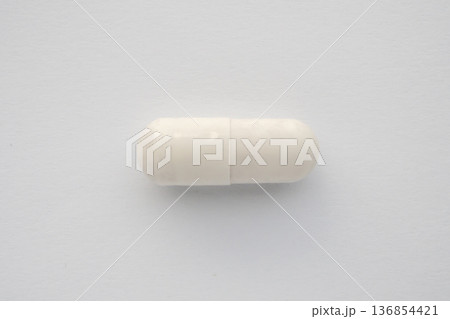 White medicine pill capsule on white background White medicine pill capsule on white background 136854421