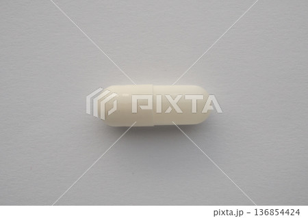 White medicine pill capsule on white background White medicine pill capsule on white background 136854424