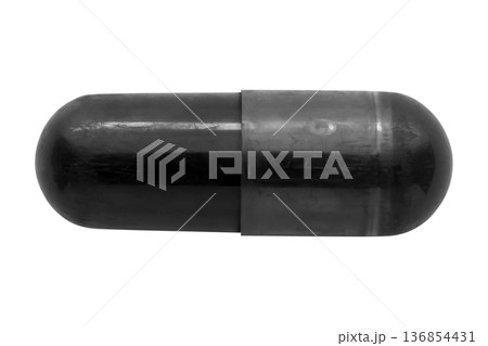 Black medicine pill activated charcoal capsule isolated on white background Black medicine pill activated charcoal capsule isolated on white background 136854431