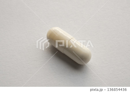 White medicine pill capsule on white background White medicine pill capsule on white background 136854436