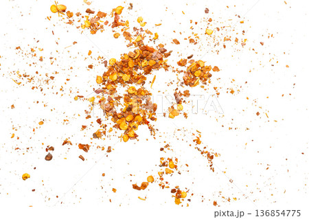 dried red chili pepper flakes and seeds isolated on white background 136854775