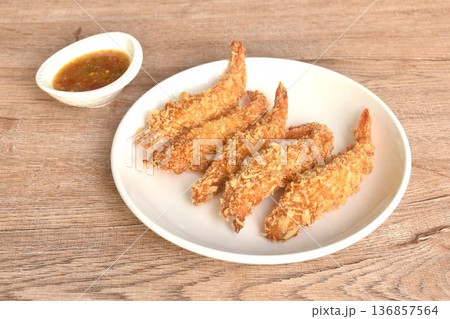 crispy fried shrimp coating flake bread and flour or tempura Japanese food on plate dipping spicy and sour seafood chili sauce 136857564