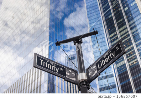 Trinity Place and Liberty Street signs at financial district intersection with modern skyscrapers in New York City USA 136857607