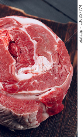 Fresh beef cut on wooden surface ready for cooking and meal preparation in kitchen Fresh beef cut on wooden surface ready for cooking and meal preparation in kitchen 136857774