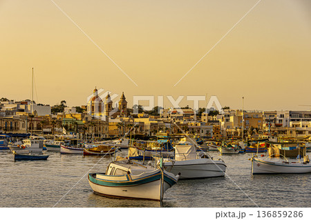 Boats in front of Marsaxlokk harbor, Malta. Boats in front of Marsaxlokk harbor, Malta. 136859286