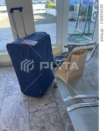 bag and suitcase in the waiting room bag and suitcase in the waiting room 136859339
