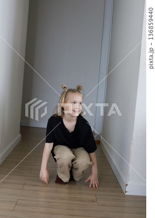 Joyful child girl playing at home. Kid 6 years old Joyful child girl playing at home. Kid 6 years old 136859440