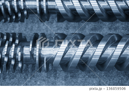 Macro view of a high-performance injection molding screw featuring optimized flight geometry for thermoplastic homogenization. Macro view of a high-performance injection molding screw featuring optimized flight geometry for thermoplastic homogenization. 136859506