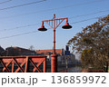 Vintage street light stands by bridge during morning in city 136859972