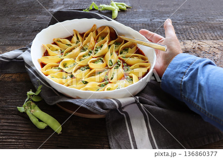 Delicious Stuffed Pasta Shells with Peas and Cheese Delicious Stuffed Pasta Shells with Peas and Cheese 136860377