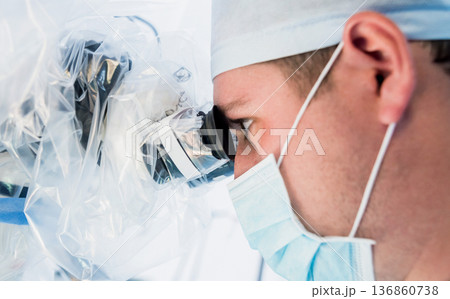 Spinal surgery. Group of surgeons in operating room with surgery equipment. Spinal surgery. Group of surgeons in operating room with surgery equipment. 136860738