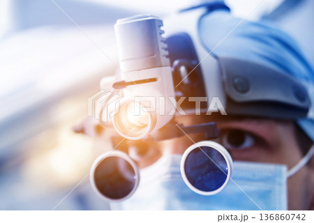 Portrait of spinal surgeon in operating room with surgery equipment. Portrait of spinal surgeon in operating room with surgery equipment. 136860742