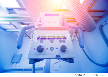X-ray room in a hospital. Classic ceiling-mounted x-ray system. 136861122