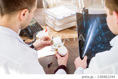 Doctors team having medical council in hospital. Discussing medical issues Doctors team having medical council in hospital. Discussing medical issues 136861244