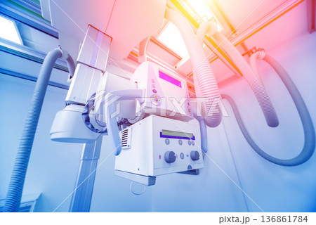 X-ray room in a hospital. Classic ceiling-mounted x-ray system. X-ray room in a hospital. Classic ceiling-mounted x-ray system. 136861784