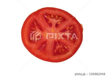 Whole and cut red tomatoes, sliced, sliced on a white plate in isolation Whole and cut red tomatoes, sliced, sliced on a white plate in isolation 136862048