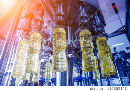 Bottling line of sunflower oil in bottles. Vegetable oil production plant 136862148
