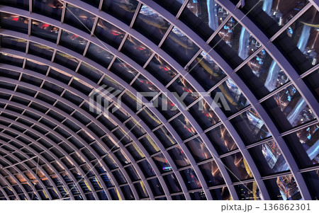 Glass canopy showcasing repeating geometric frames and day light 136862301