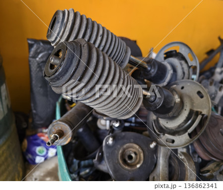 Pile of rusted motor components and gears in cluttered scrap heap Pile of rusted motor components and gears in cluttered scrap heap 136862341